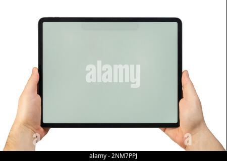 Grande tablette en mains avec écran vide et propre isolé sur fond blanc de studio Banque D'Images