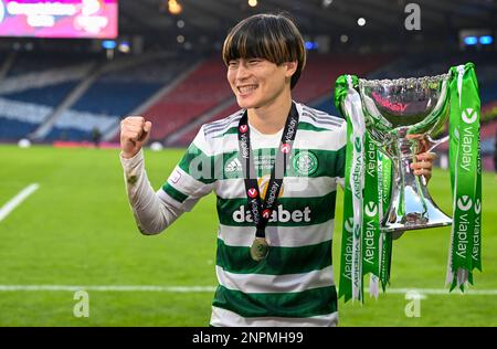 Glasgow, UK. 26th Feb, 2023. CelticÕs Japanese players Tomoki Iwata and  Yuki Kobayashi flank Kyogo Furuhashi after the The Scottish League Cup  match at Hampden Park, Glasgow. Picture credit should read: Neil