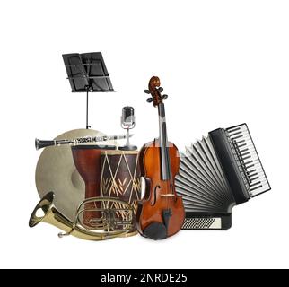 Groupe d'instruments de musique différents sur fond blanc Banque D'Images