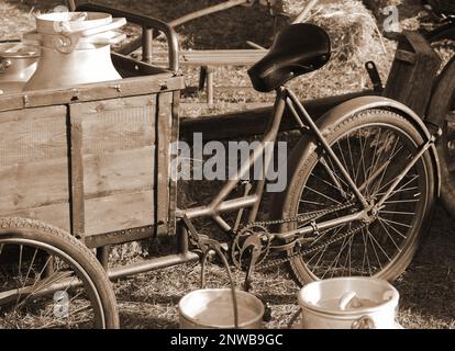 vélo utilisé par milkman pour transporter les boîtes de lait au ton sépia Banque D'Images