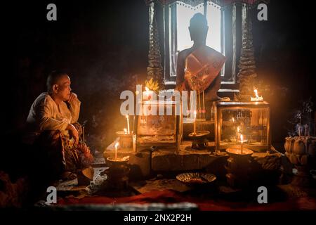 Bayon temple, Woman praying, Angkor Thom, Angkor, Siem Reap, Cambodia Stock Photo