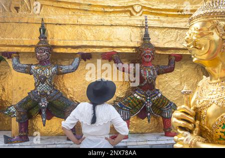 Statues of demons on a Golden Chedi, at the temple of the Emerald Buddha Wat Phra Kaeo, Grand Palace, Bangkok, Thailand Stock Photo