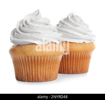 Délicieux petits gâteaux décorés de crème sur fond blanc Banque D'Images