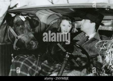 L'acteur américain Fred MacMurray et l'actrice Barbara Stanwyck dans le film Remember the Night, USA 1940 Banque D'Images