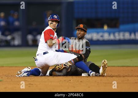 Puerto Rico second baseman Javier Baez (9) returns to the dugout during a  World Baseball Classic game against Nicaragua, Saturday, March 11, 2023, in  Miami. (AP Photo/Marta Lavandier Stock Photo - Alamy