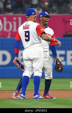 Second baseman of Puerto Rico, Javier Baez (R) makes Yurendell de Caster a  double play in the 8th inning during semifinal of World Baseball Classic at  Dodger Stadium in Los Angeles, U.S.A