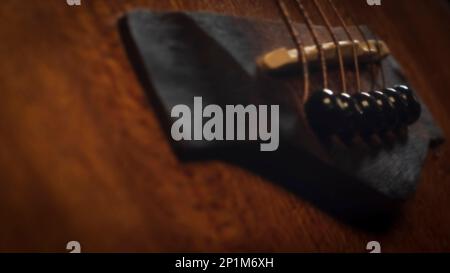 Image floue de pont de guitare acoustique, fond d'écran de musique Banque D'Images