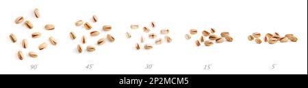 Une poignée de pistaches de haute qualité de cinq angles différents sur un fond blanc isolé Banque D'Images