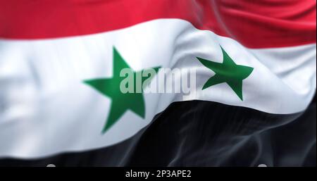 Détail du drapeau national syrien agité. Tricolore horizontal rouge, blanc, noir, 2 étoiles vertes à cinq pointes. 3d rendu d'illustration. Mise au point sélective. Banque D'Images