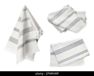 Ensemble avec des serviettes de cuisine propres sur fond blanc Banque D'Images
