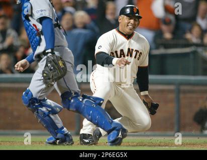 San Francisco Giants' Andres Galarraga swings for a home run off Houston  Astros' Roy Oswalt in the second inning Tuesday Sept. 18, 2001, at Pacific  Bell Park in San Francisco. At right is Astro's catcher Brad Ausmus. (AP  Photo/George Nikitin Stock Pho