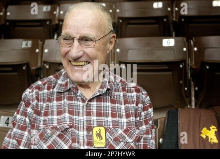 FILE - In this Jan. 19, 2010 file photo, former professional basketball player Kenny Sailors, 89, laughs at a joke from some Wyoming fans at Arena Auditorium in Laramie, Wyo. Legendary St. John's University coach Joe Lapchick wrote in 1965 that Sailors 'started the one-handed jumper which is probably the shot of the present and the future.' (AP Photo/Casper Star-Tribune, Tim Kupsick, File)