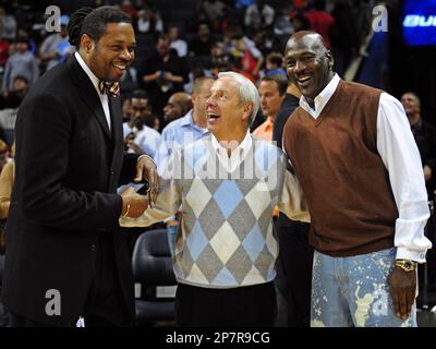 Former North Carolina and NBA player Sam Perkins, North Carolina basketball coach Roy Williams and former NBA great and current Charlotte Bobcats part-owner Michael Jordan talk during halftime of the Charlotte Bobcats' NBA basketball game against the Indiana Pacers in Charlotte, N.C., Sunday, Nov. 22, 2009. The Bobcats defeated the Pacers 104-88. (AP Photo/The Charlotte Observer, Jeff Siner)