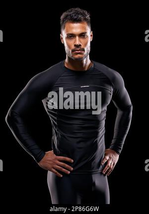 Il a ce corps... portrait en studio d'un beau jeune homme dans les vêtements de sport. Banque D'Images
