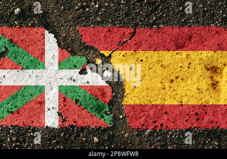 Sur la chaussée, il y a des images des drapeaux du pays Basque et de l'Espagne, comme une confrontation entre les deux pays. Image conceptuelle. Banque D'Images