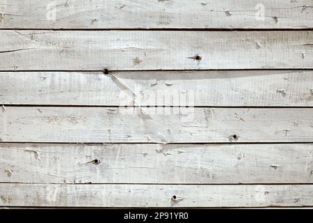 La texture du mur en bois blanc, d'un abri rustique peint. Les planches horizontales background Banque D'Images