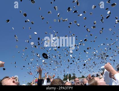 Graduates of the U.S.Naval Academy toss their hats at the Naval Stadium in Annapolis,Md., on Friday May 23, 2008. The class of 2008's 1,037 midshipmen graduated from the academy during it's 158th traditional ceremony. (AP Photo/ Jamie C. Horton)