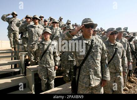 U.S. Army soldiers from the 10th Mountain Division salute during a transition of authority ceremony in a U.S. military camp in Baghdad, Iraq, Nov. 2, 2007. U.S. soldiers from 101st Airborne Division took over from the 10th Mountain Division at Camp Striker in Baghdad, as part of a rotation of U.S. military units in Iraq. (AP Photo/Erik de Castro, Pool)