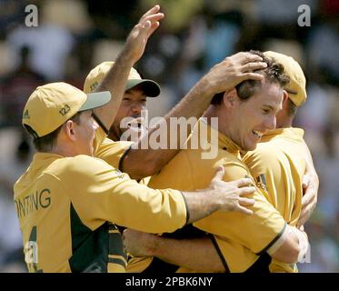 Australia's Shaun Tait, 2nd right, celebrates taking the wicket of South Africa's A.B. de Villiers with his captain Ricky Ponting, left, and teammate Andrew Symonds, second left, after his delivery was caught out by Australia wicketkeeper Adam Gilchrist, not seen, during the Cricket World Cup semifinal match between Australia and South Africa at the Beausejour Cricket Ground in Gros Islet, St. Lucia, Wednesday April 25, 2007. (AP Photo/Matt Dunham)