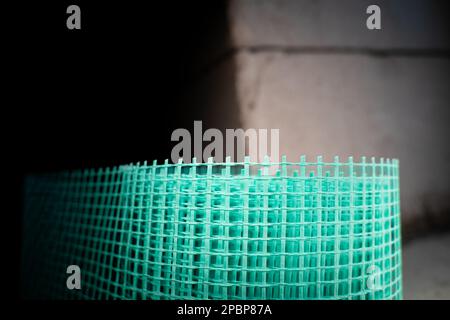Façade renforcée en plastique en maille de couleur verte. Filet de plâtre, prévention des fissures Banque D'Images