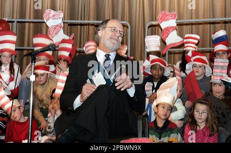 Students at Robinson Elementary School wear striped hats as New Jersey Gov. Jon S. Corzine reads Dr. Seuss's 'The Cat in the Hat' to the school children in Hamilton, N.J., during a Read Across America event, Friday, March 2, 2007. (AP Photo/Mel Evans)