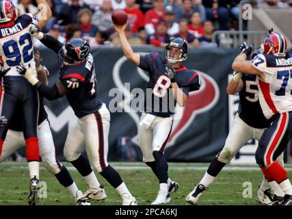 HOUP2002090801 - Houston, Sept. 8, (UPI) -- Houston Texans quarterback  David Carr (8) tries to escape the Dallas Cowboys defense during the 2nd  quarter on Sept. 8, 2002, in Houston. The Texans