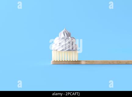 Brosse à dents en bois avec poils et dentifrice. Concept de dentifrice délicieux, dentifrice sous forme de curl de crème dessert. Banque D'Images