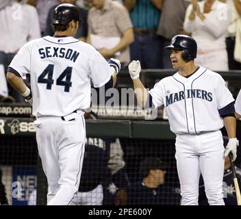 Seattle Mariners' Richie Sexson, right, is greeted at home by Adrian Beltre  following Sexson's seventh inning home run against the Oakland Athletics  during opening day at a baseball game, Monday, April 2