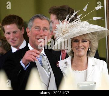 Britain's Prince Charles, the Prince of Wales, and his wife Camilla, the Duchess of Cornwall, leave the Guildhall in Windsor, England, after their civil wedding ceremony, Saturday, April 9, 2005. At left is Prince Harry, background Prince William. (AP Photo / Tim Ockenden, PA Pool)