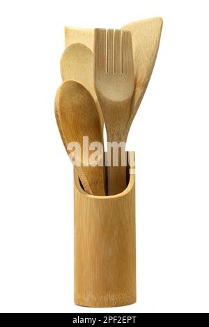 Ensemble d'ustensiles de cuisine en bois dans un pot en bois. ustensiles de cuisine traditionnels en bois Banque D'Images