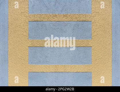 Motif à deux tons de zones rectangulaires bleues en plâtre jaune granuleux Banque D'Images