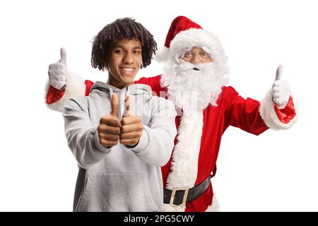 Joyeux gars afro-américain et le père noël gestant les pouces vers le haut isolés sur fond blanc Banque D'Images