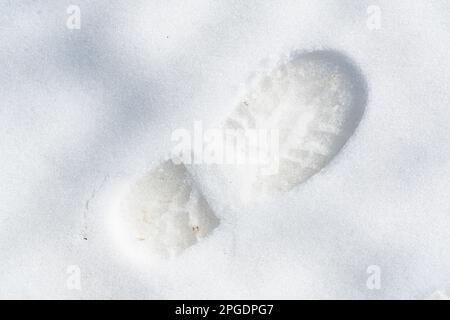 Empreinte d'une chaussure sur la neige Banque D'Images