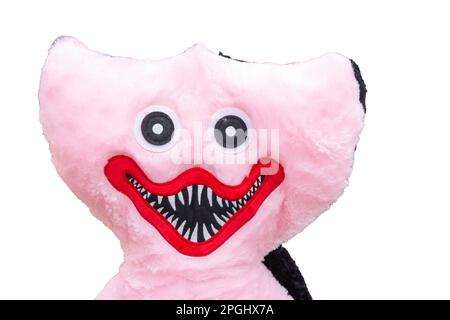 devant d'une poupée douce en peluche de couleur rose avec grand sourire Banque D'Images