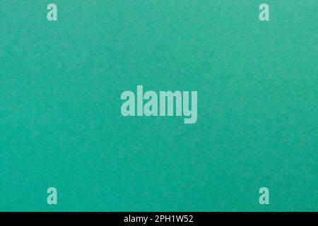 Arrière-plan de feuille de papier teinté turquoise. Abat-jour bleu vert minéral. Banque D'Images