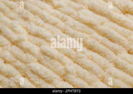 Tissu tricoté beige doux comme arrière-plan, gros plan Banque D'Images