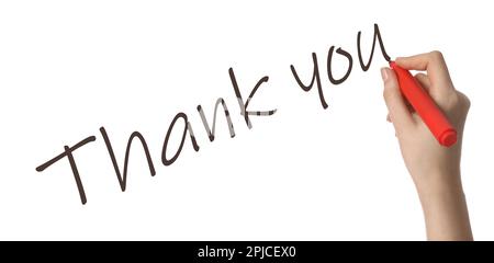Femme écrivant phrase Merci sur fond blanc, gros plan Banque D'Images