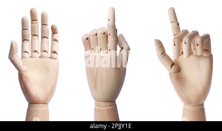 Placez les mains en bois de mannequins montrant différents gestes sur fond blanc Banque D'Images