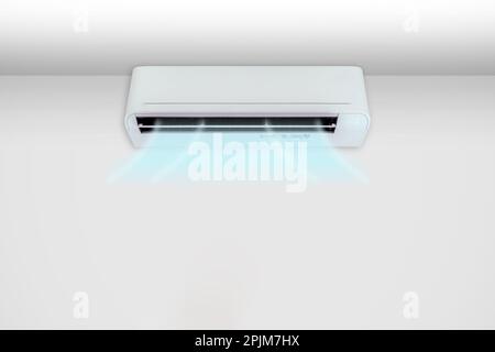 Homme mettant le climatiseur en marche. Banque D'Images