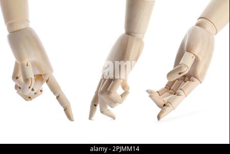 Placez les mains en bois des mannequins sur fond blanc Banque D'Images