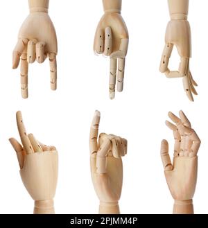Placez les mains en bois de mannequins montrant différents gestes sur fond blanc Banque D'Images