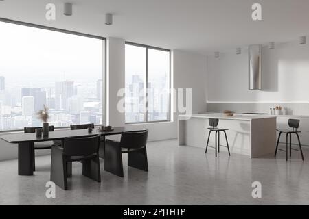 Cuisine maison blanche intérieure avec coin cuisine et salle à manger, bar île avec chaises. Espace de restauration moderne, sol en béton gris. Fenêtre panoramique Banque D'Images