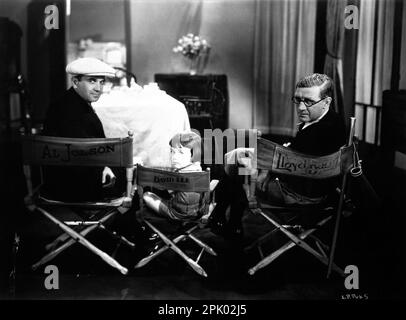 AL JOLSON DAVEY LEE et le réalisateur LLOYD BACON sur le plateau Candid pendant le tournage de SAY IT AVEC DES CHANSONS 1929 réalisateur LLOYD BACON Story Darryl F. Zanuck et Harvey Gates la Vitaphone Corporation / Warner Bros. Banque D'Images