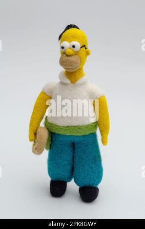 Jouet de figurine Homer Simpson sur fond blanc Banque D'Images