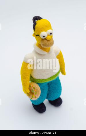 Jouet de figurine Homer Simpson sur fond blanc Banque D'Images