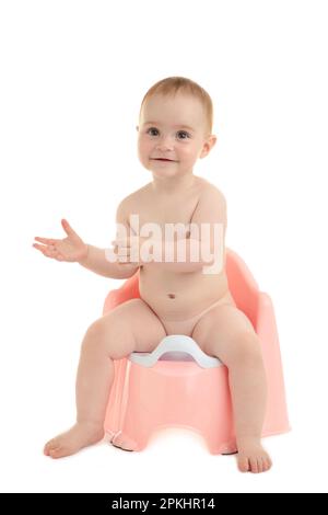 Bébé souriant sur un pot isolé sur fond blanc. Vue de dessus Banque D'Images