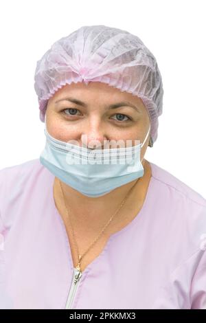 Une femme dans un médecin avec un masque médical regarde la caméra Banque D'Images