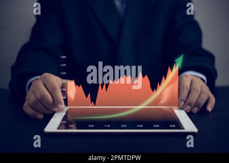 graphiques financiers et analyse graphique marketing montrant le chiffre d'affaires croissant tablette d'écran numérique, l'entreprise au sujet de la stratégie pour la croissance et le succès. Banque D'Images