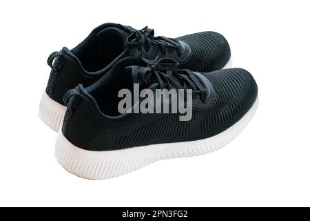 Utilisé des sneakers tendance bleu foncé avec lacets isolés sur fond blanc avec passe-cheveux, vue grand angle, gros plan, format horizontal. Banque D'Images