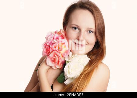 Portrait of a young woman with flowers Banque D'Images